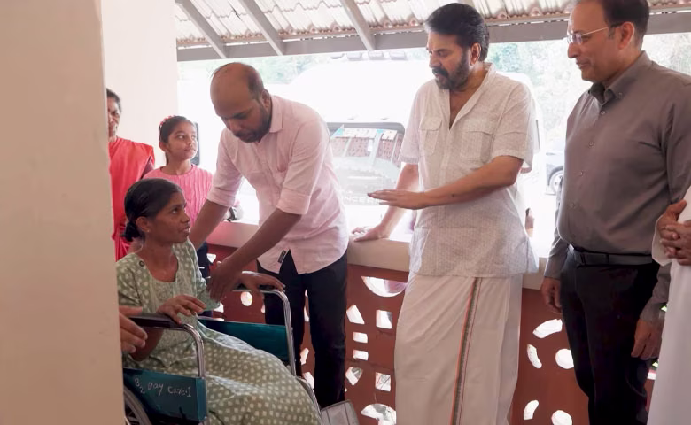Megastar Mammootty holding the hand of Adimali landslide survivor Sandhya at Rajagiri Hospital